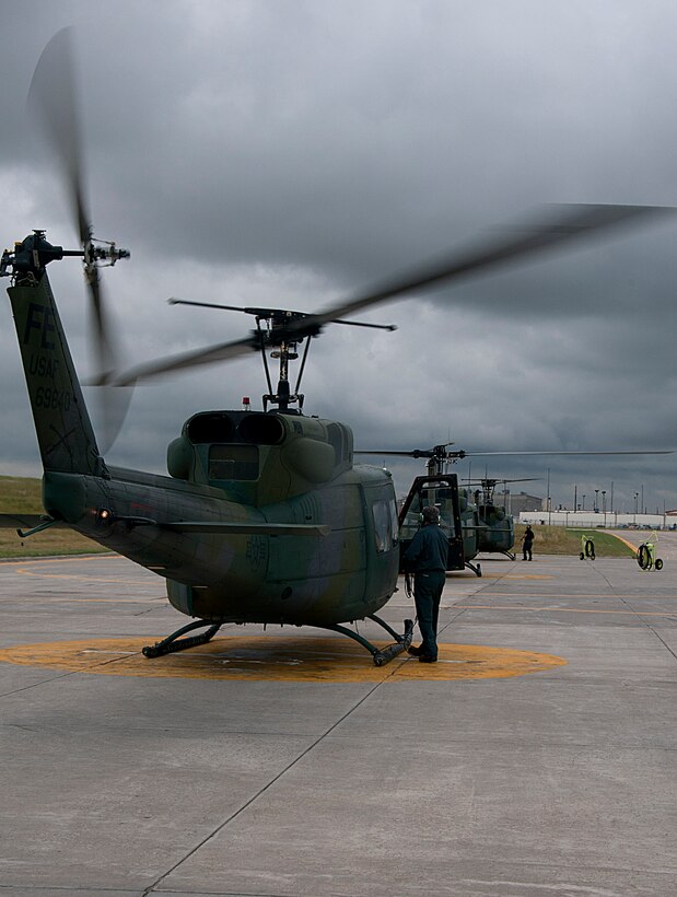 Three helicopter crews prepare for take-off July 16 from the 37th Helicopter Squadron. Two of the helicopters performed convoy escort duties while the third performed a routine training mission. (U.S. Air Force photo by Airman 1st Class Brandon Valle)