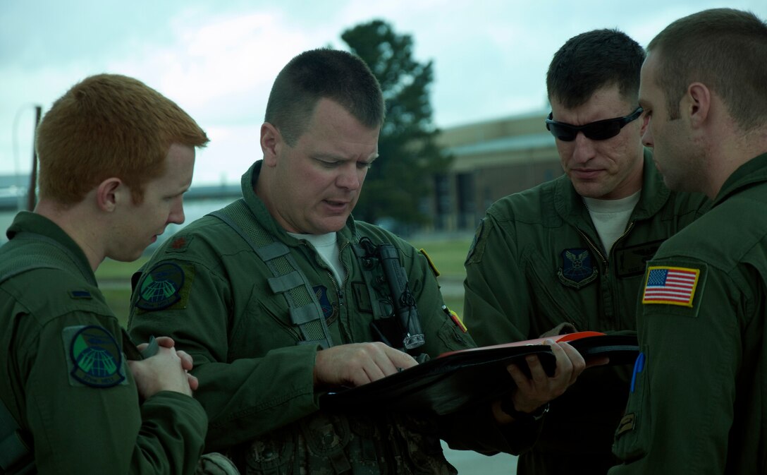 Maj. Duke Warner, 37th Helicopter Squadron pilot, briefs his crew July 16 before they begin pre-flight checks on their helicopter. The four-man crew performed a routine training mission in southern Wyoming. (U.S. Air Force photo by Airman 1st Class Brandon Valle)