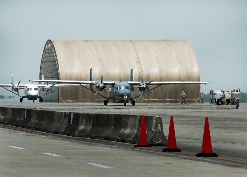 The last two C-145s on the Duke Field flightline prepare to taxi out for take off July 1.  All of the C-145s were prepared and launched July 1 in celebration of the Airmen of the 592nd Special Operations Maintenance Squadron and the 919th Special Operations Aircraft Maintenance Squadron taking over maintenance responsibilities from the contractor Nevada Corporation.  (U.S. Air Force photo/Maj. Terry Lisenbee)