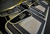 Aircraft binders wait to be presented during a crew chief aircraft assignment ceremony at Duke Field, June 11.  The 592nd Special Operations Maintenance Squadron and the 919th Special Operations Aircraft Maintenance Squadron assigned a dedicated crew chief and assistant crew chief to each of the 16 C-145s at Duke Field.  Each aircraft has an active-duty and reserve crew chief assigned to it.  The squadrons took over maintenance responsibility for the aircraft on July 1.  (U.S. Air Force photo/Dan Neely)