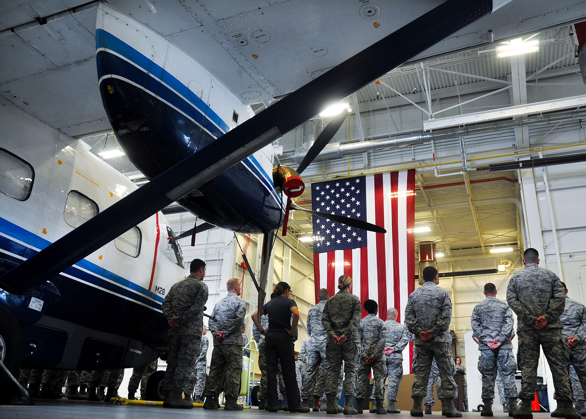 Active duty and reserve maintainers stand by their aircraft during a crew chief aircraft assignment ceremony at Duke Field, June 11.  The 592nd Special Operations Maintenance Squadron and the 919th Special Operations Aircraft Maintenance Squadron assigned a dedicated crew chief and assistant crew chief to each of the 16 C-145s at Duke Field.  Each aircraft has an active-duty and reserve crew chief assigned to it.  The squadrons took over maintenance responsibility for the aircraft on July 1. (U.S. Air Force photo/Dan Neely)