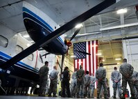 Active duty and reserve maintainers stand by their aircraft during a crew chief aircraft assignment ceremony at Duke Field, June 11.  The 592nd Special Operations Maintenance Squadron and the 919th Special Operations Aircraft Maintenance Squadron assigned a dedicated crew chief and assistant crew chief to each of the 16 C-145s at Duke Field.  Each aircraft has an active-duty and reserve crew chief assigned to it.  The squadrons took over maintenance responsibility for the aircraft on July 1. (U.S. Air Force photo/Dan Neely)