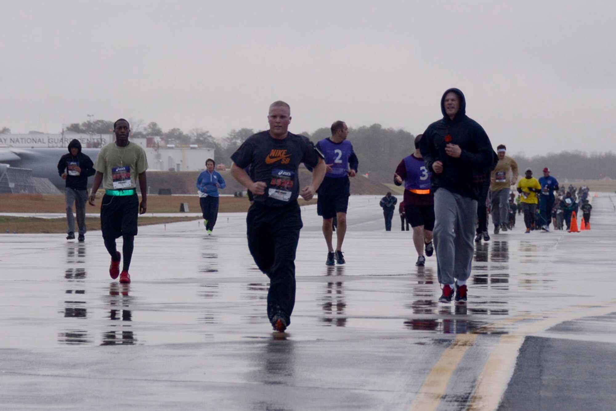 Over 190 94th Airlift Wing members participate in the first annual Falcon 5K, a five kilometer fun-run, Dec. 8, 2013. Sponsored by the Dobbins Top 3, proceeds from the event go to the Dobbins Emergency Fund used for assisting Airmen in times of need. (U.S.Air Force photo/Senior Airman Elizabeth Van Patten)