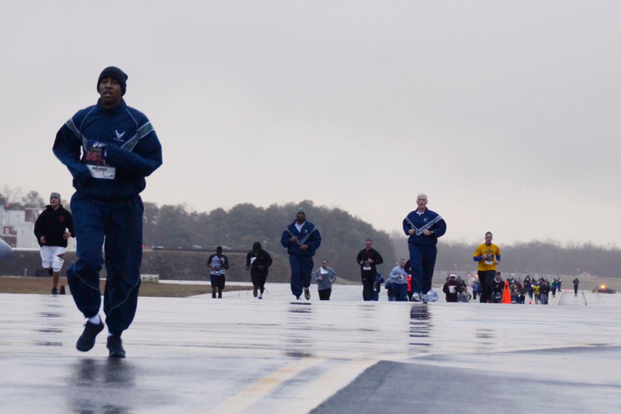 Over 190 94th Airlift Wing members participate in the first annual Falcon 5K, a five kilometer fun-run, Dec. 8, 2013. Sponsored by the Dobbins Top 3, proceeds from the event go to the Dobbins Emergency Fund used for assisting Airmen in times of need. (U.S.Air Force photo/Senior Airman Elizabeth Van Patten)