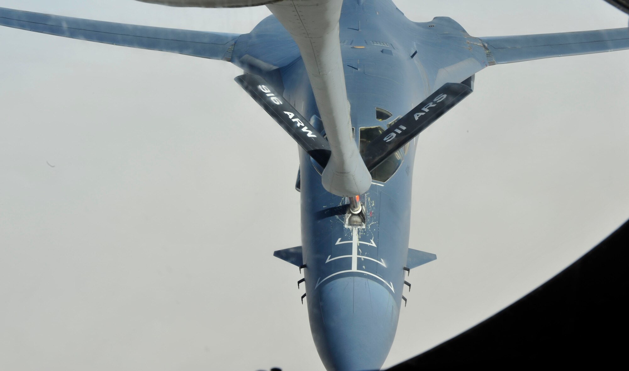 A B-1B Lancer assigned to the 37th Expeditionary Bomb Squadron approaches a KC-135 Stratotanker, assigned to the 340th Expeditionary Air Refueling Squadron both from Al Udeid Air Base, Qatar, fly in support of Operation Enduring Freedom, July 17, 2014. The B-1B Lancer is a four-engine supersonic variable-sweep wing, jet-powered strategic bomber used by the United States Air Force. It was first envisioned in the 1960s as a supersonic bomber with Mach 2 speed. (U.S. Air Force photo by Senior Airman Colin Cates)