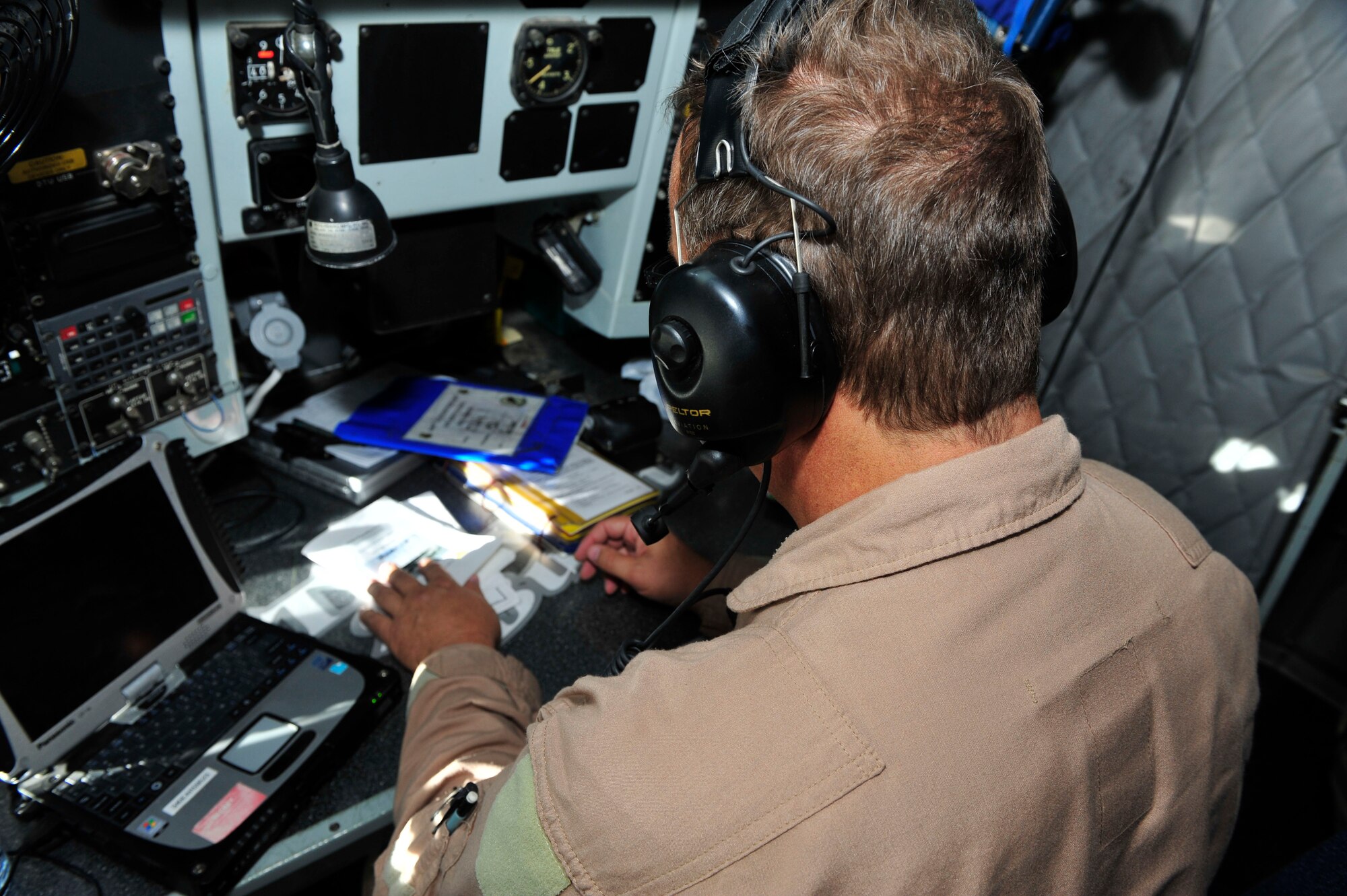 U.S. Air Force Senior Master Sgt. Floyd W. Atkins, 340th Expeditionary Air Refueling Squadron boom operator, performs preflight checklists at Al Udeid Air Base, Qatar, July 17, 2014. The pilots and boom operator all run through pre-flight checks to ensure all systems are operating properly and the aircraft is mission ready prior to takeoff. Atkins’s reached his 8,000th refueling hour during the mission. (U.S. Air Force photo by Senior Airman Colin Cates)