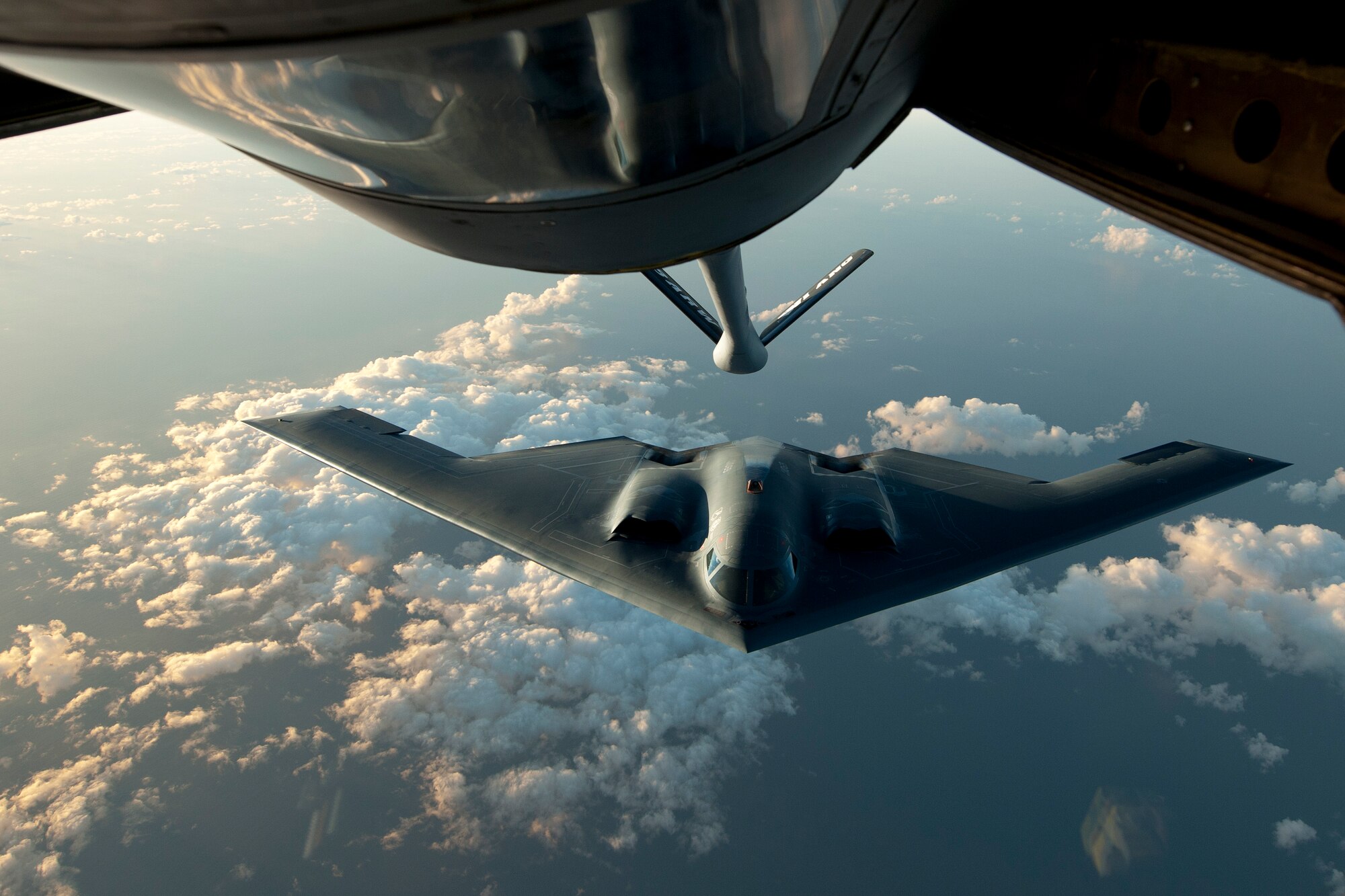 A B-2 Spirit flies into position during a refueling mission over the North Atlantic Ocean June 11, 2014. The B-2 is conducting training flights and regional familiarization in the U.S. European Command area of operations. The B-2 is a multi-role bomber capable of delivering both conventional and nuclear munitions. (U.S. Air Force photo by Tech. Sgt. Paul Villanueva II/Released)