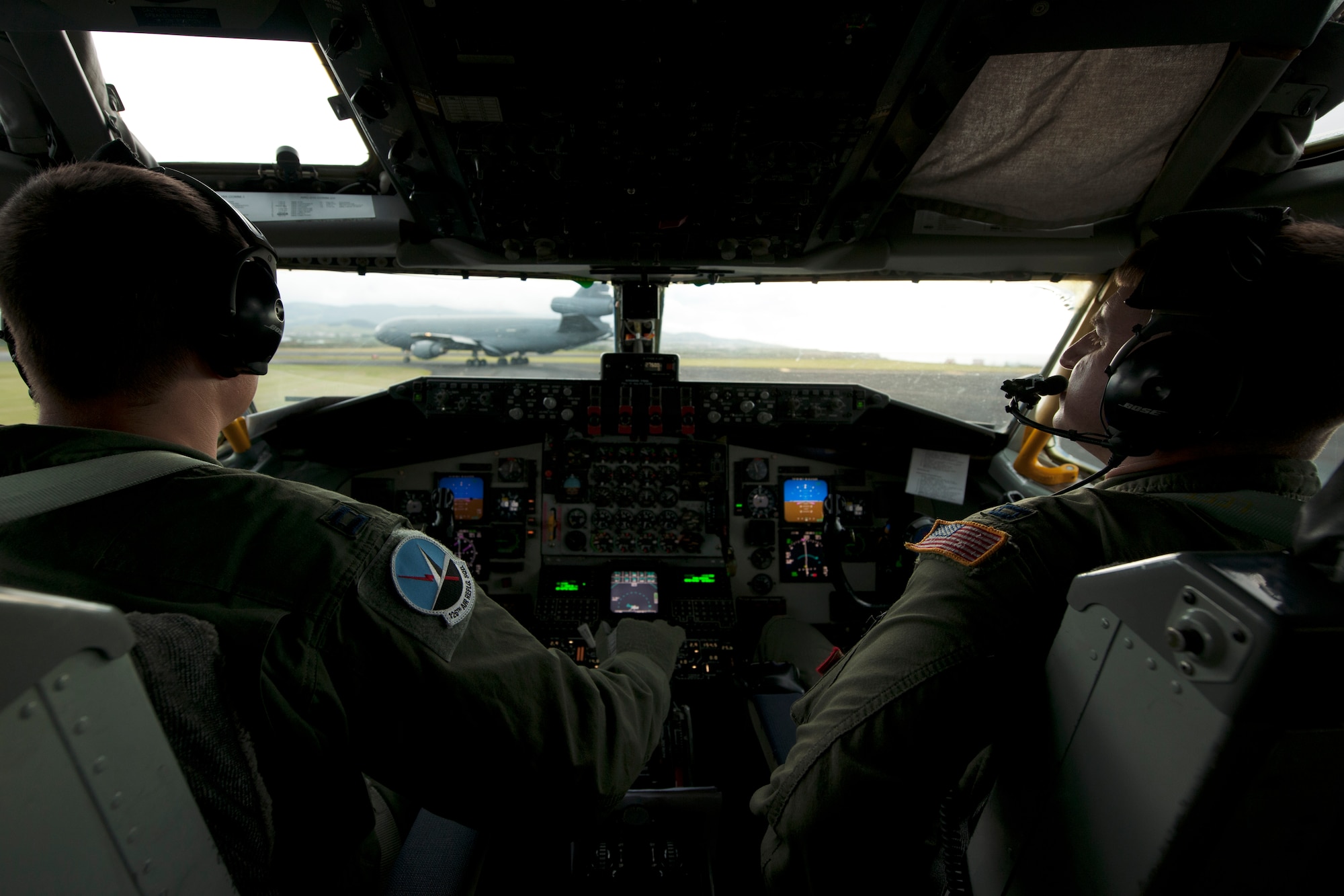 U.S. Air Force Captains Rory Cattelan and Ralph Johnson III, 128th Operations Support Squadron KC-135R Stratotanker pilots, wait to take off for a refueling mission June 11, 2014, Lajes Field, Azores, Portugal. The refueling mission is over the North Atlantic Ocean and will refuel a pair of B-2 Spirits that are conducting training flights and regional familiarization in the U.S. European Command area of operations. The B-2 is a multi-role bomber capable of delivering both conventional and nuclear munitions. (U.S. Air Force photo by Tech. Sgt. Paul Villanueva II/Released)