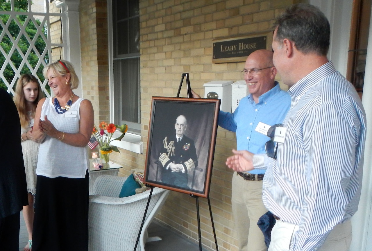Navy Vice Adm. Kurt W. Tidd and members of the Leahy family unveil a portrait of Fleet Adm. William D. Leahy July 17, 2014, during a ceremony renaming the house in honor of the highest-ranking officer from World War II. DoD photo by Jim Garamone