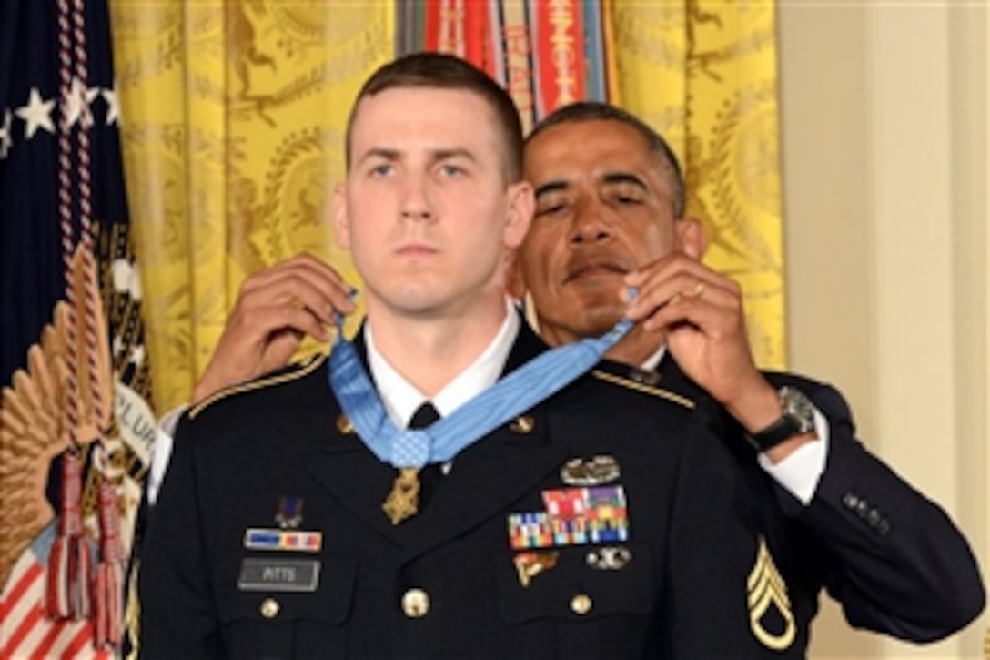 President Barack Obama awards the Medal of Honor to former Army Staff Sgt. Ryan Pitts at the White House, July 21, 2014. Pitts received the nation's highest military honor for his actions on July 13, 2008, in Wanat, Afghanistan, when he was assigned to Company C, 2nd Battalion, 503rd Infantry Regiment, 173rd Airborne Brigade. 