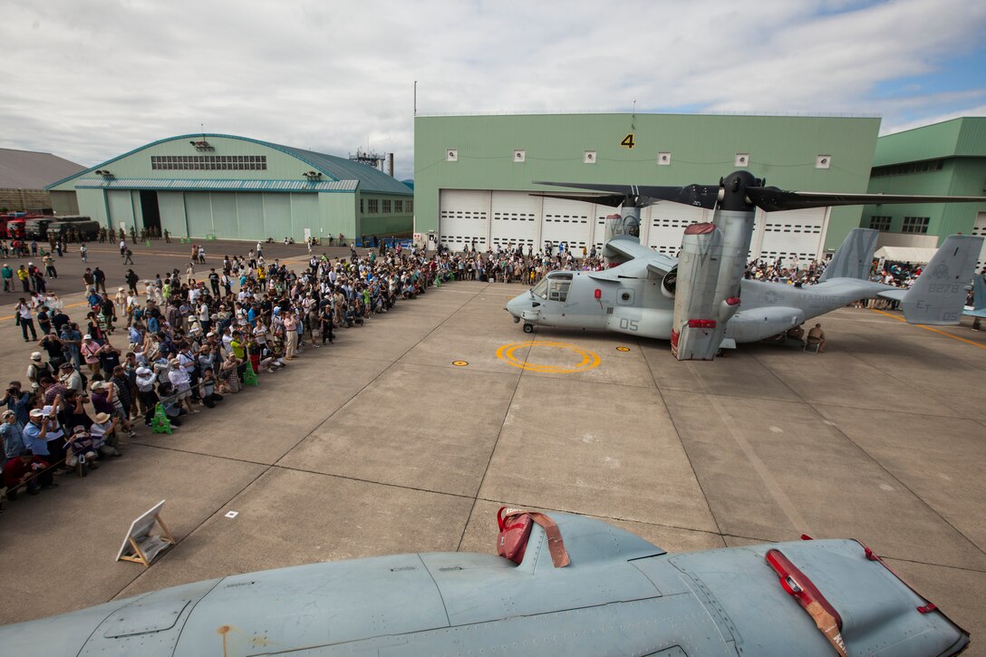 Sapporo Okadama Airport, Hokkaido Prefecture, Japan – Spectators observe the MV-22 Osprey as part of the Sapporo Air Show at Sapporo Okadama Airport, July 20. More than 50,000 spectators viewed U.S. and Japan military and commercial aircraft that were either on static display or showcased flying over the airport. “It is a great opportunity, not only for the United States military, but also for the Japan military to showcase their aircraft. We want to show the Japanese public what we do and why our alliance is so important,” said Maj. Gen. Andrew W. O’Donnell Jr., the deputy commander of United States Forces, Japan. This is the first time the Osprey has flown to Sapporo. The pilots and crew of the Osprey are with Marine Medium Tiltrotor Squadron 262 (Reinforced), 31st Marine Expeditionary Unit, III Marine Expeditionary Force. (U.S. Marine Photo by Cpl. Henry Antenor)