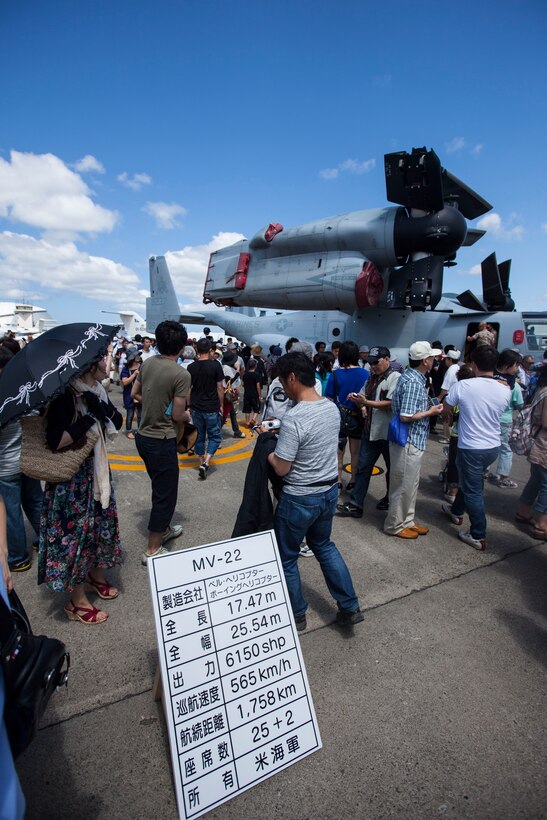 Sapporo Okadama Airport, Hokkaido Prefecture, Japan – A posted sign  helps spectators  understand the capabilities of the MV-22 Osprey in front of a static display during the Sapporo Air Show at Sapporo Okadama Airport, July 20. More than 50,000 spectators viewed U.S. and Japan military and commercial aircraft that were either on static display or showcased flying over the airport. “It is a great opportunity, not only for the United States military, but also for the Japan military to showcase their aircraft. We want to show the Japanese public what we do and why our alliance is so important,” said Maj. Gen. Andrew W. O’Donnell Jr., the deputy commander of United States Forces, Japan. This is the first time the Osprey has flown to Sapporo. The pilots and crew of the Osprey are with Marine Medium Tiltrotor Squadron 262 (Reinforced), 31st Marine Expeditionary Unit, III Marine Expeditionary Force. (U.S. Marine Photo by Cpl. Henry Antenor)	