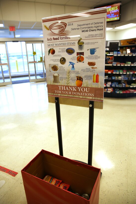 A Feds Feed Families donation collection box sits in a Marine Corps Exchange at Marine Corps Air Station Cherry Point, N.C., July 21, 2014.  The food drive runs through the end of August. Cherry Point currently has more than seven donation locations across the air station.  Service members and civilians who live and work at Cherry Point support the U.S. Department of Agriculture and Department of Defense program by donating nonperishable items for distribution to local food banks. For more information visit your local commissary.  