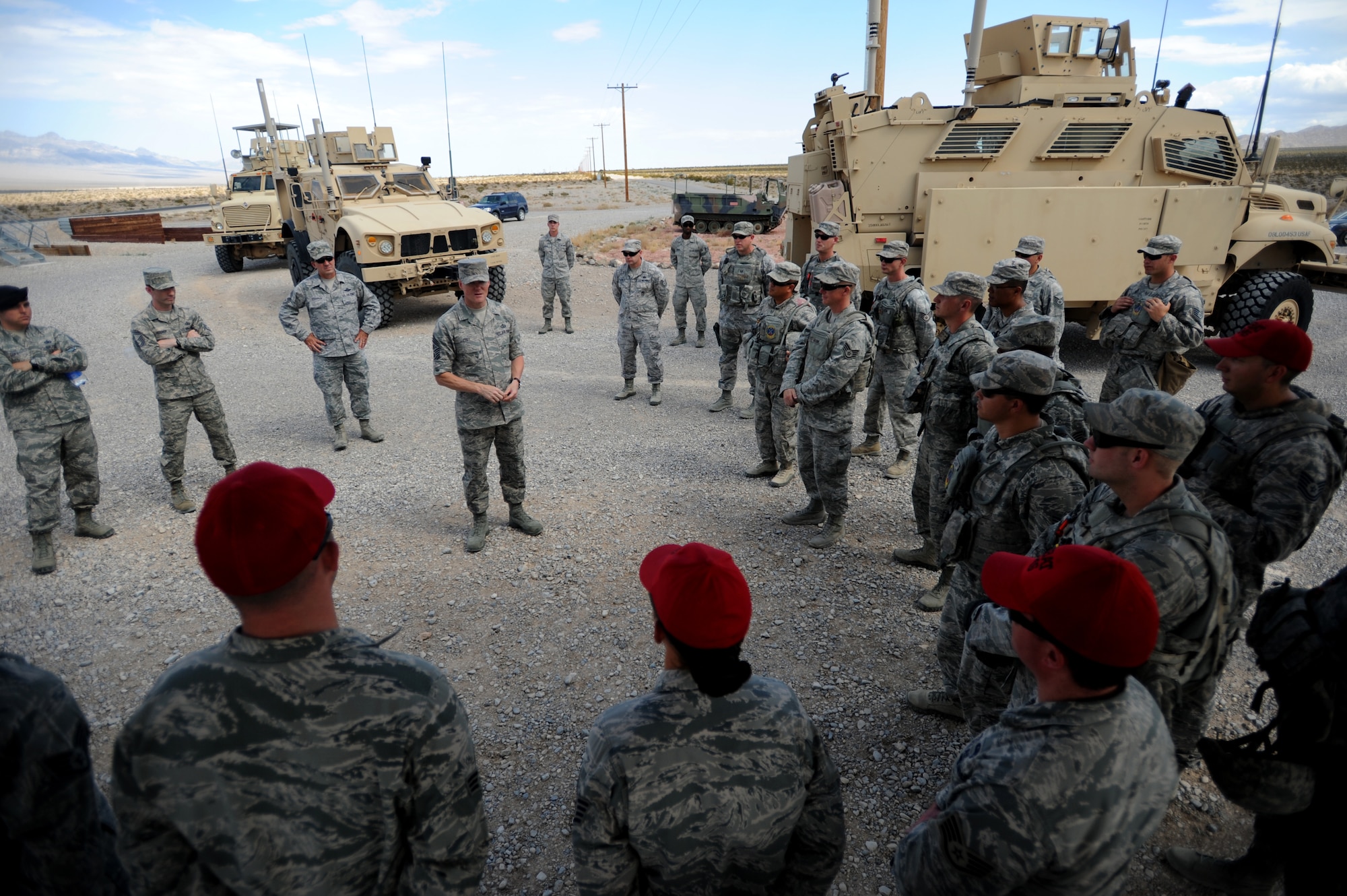 Chief Master Sgt. of the Air Force James A. Cody discusses the importance Airmen of the 799th Security Forces Squadron and 99th Ground Combat Training Squadron play in remotely-piloted aircraft operations July 16, 2014, on Creech Air Force Base, Nev. During his visit, Cody saw firsthand the operations tempo of the base’s Airmen as they fulfill their mission by providing intelligence, surveillance and reconnaissance, maintenance, base support and defense, and other capabilities in support of combatant commanders around the globe. (U.S. Air Force photo/Tech. Sgt. Nadine Barclay)