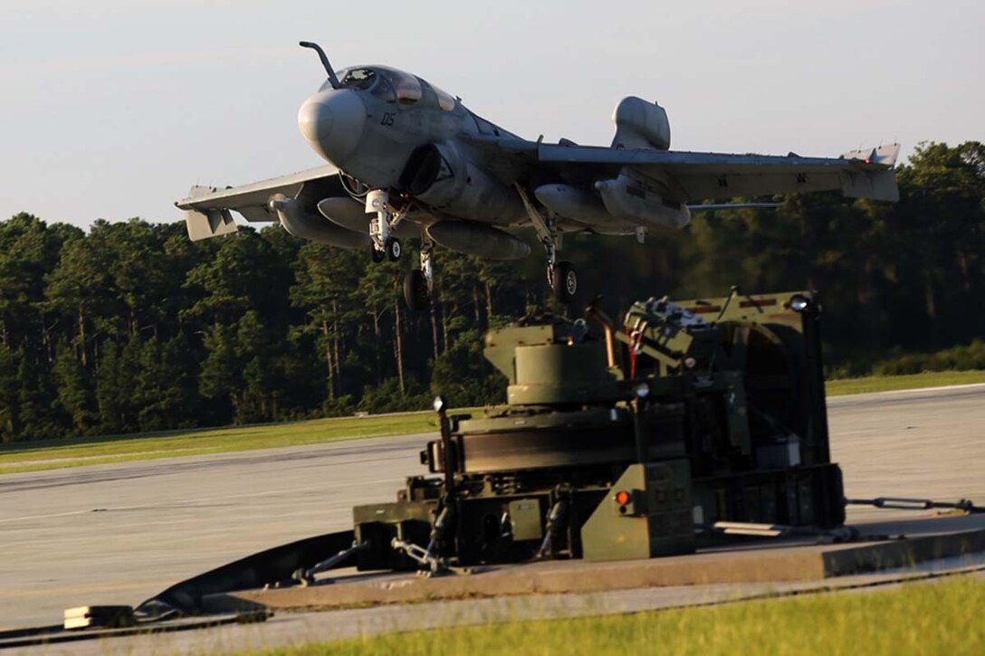 An EA-6B Prowler descends for a touch-and-go landing during field carrier landing practice at Marine Corps Auxiliary Landing Field Bogue, N.C., July 17. The training allowed student pilots with Marine Tactical Electronic Warfare Training Squadron 1 to enhance their abilities for landing on an expeditionary airfield.