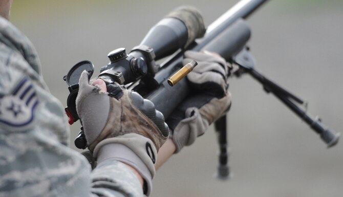 Staff Sgt. Ryan Link ejects an expended casing from his weapon while training with the M24 Sniper Weapon System July 11, 2014, at Joint Base Elmendorf-Richardson, Alaska. The M24 is a military version of the Remington Model 700, a 7.62 mm caliber rifle, and has been in service with the U.S. military since 1988. Link is a native of West Branch, Mich., and is assigned to the 673rd Security Forces Squadron. (U.S. Air Force photo/Justin Connaher)