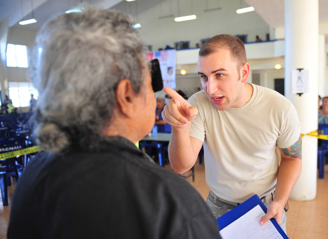 Staff Sgt. Nicholas Hubbard screens a patient during an eye exam July 21, 2014, in Neiafu, Tonga. A health services outreach was held during Operation Pacific Angel-Tonga to provide acute healthcare, educate citizens on health issues and work with the local hospital for referral services. Hubbard is deployed from Kadena Air Base, Japan. Hubbard is an optometry technician. (U.S. Air Force photo/Staff Sgt. Rachelle Coleman)