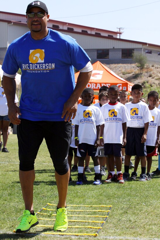 Young aspiring athletes, ages 6-17, run various conditioning and training courses while being coached by former professional football players during the 4th Annual Eric Dickerson Foundation Youth Football and Cheer Camp, here, July 10 and 11.