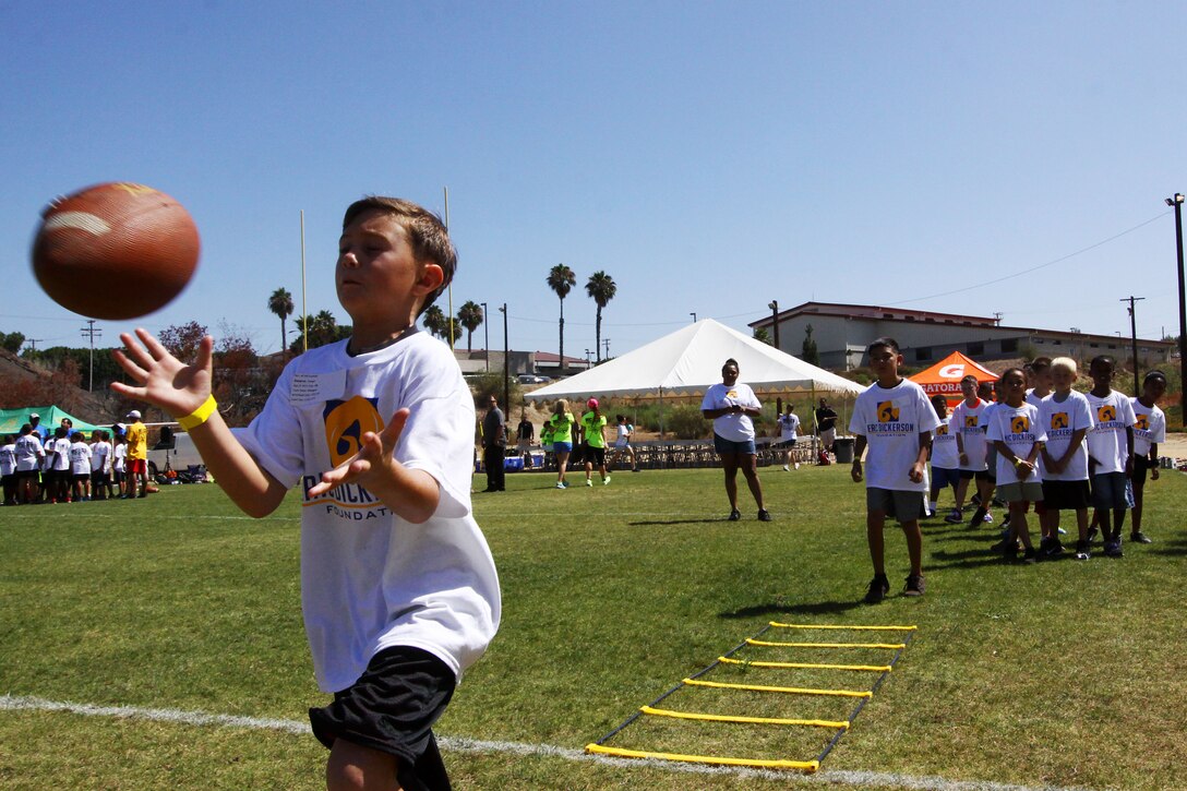 Young aspiring athletes, ages 6-17, run various conditioning and training courses while being coached by former professional football players during the 4th Annual Eric Dickerson Foundation Youth Football and Cheer Camp, here, July 10 and 11.