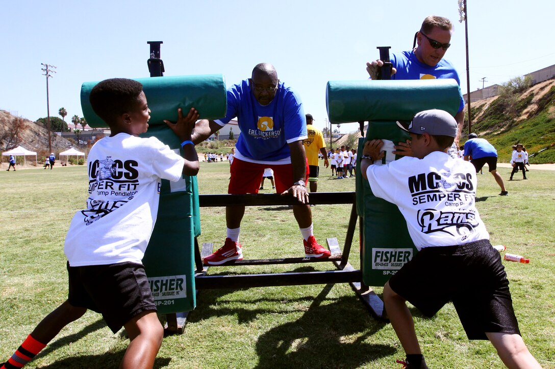 Young aspiring athletes, ages 6-17, run various conditioning and training courses while being coached by former professional football players during the 4th Annual Eric Dickerson Foundation Youth Football and Cheer Camp, here, July 10 and 11.