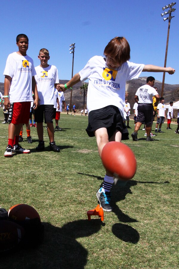 Young aspiring athletes, ages 6-17, run various conditioning and training courses while being coached by former professional football players during the 4th Annual Eric Dickerson Foundation Youth Football and Cheer Camp, here, July 10 and 11.