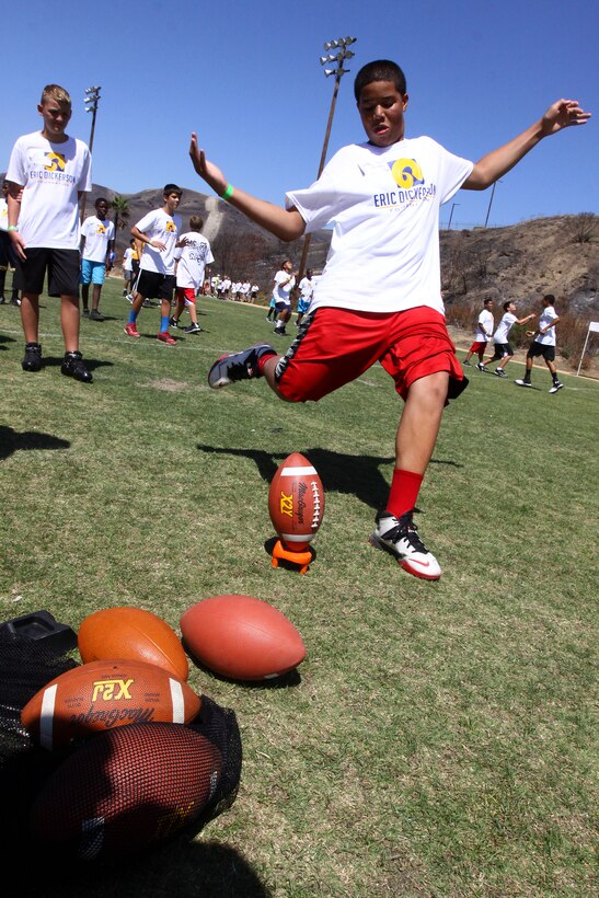 Young aspiring athletes, ages 6-17, run various conditioning and training courses while being coached by former professional football players during the 4th Annual Eric Dickerson Foundation Youth Football and Cheer Camp, here, July 10 and 11.