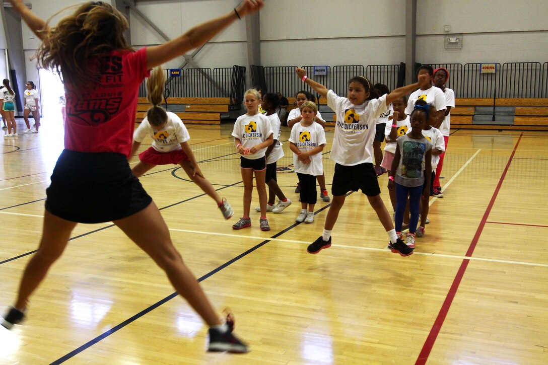 Young aspiring athletes, ages 6-17, run various conditioning and training courses while being coached by former professional football players during the 4th Annual Eric Dickerson Foundation Youth Football and Cheer Camp, here, July 10 and 11.