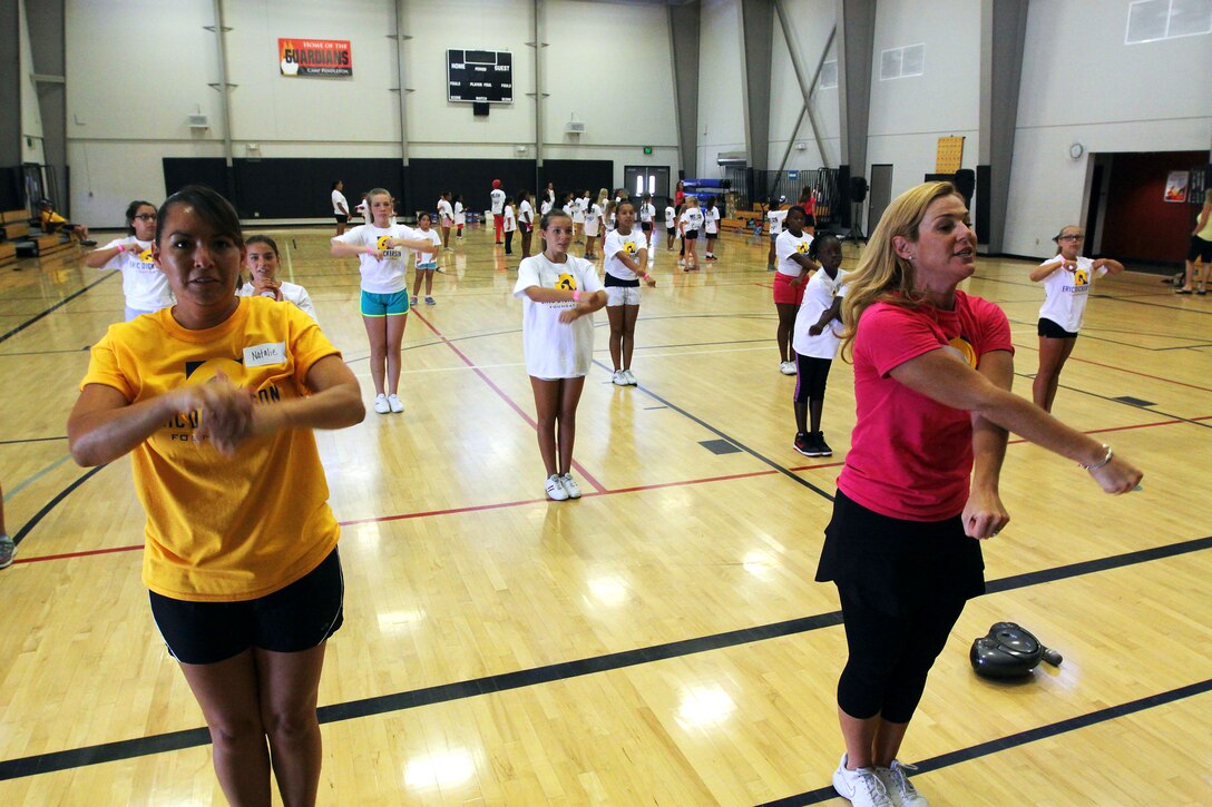 Young aspiring athletes, ages 6-17, run various conditioning and training courses while being coached by former professional football players during the 4th Annual Eric Dickerson Foundation Youth Football and Cheer Camp, here, July 10 and 11.
