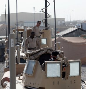 Turret gunners with Combat Logistics Battalion 7 prepare their vehicles before a combat logistics patrol aboard Camp Leatherneck, Afghanistan, July 14, 2014. The turret gunners with CLB-7 act as the eyes and ears while being the guardian angels of each combat logistics patrol conducted during their deployment. (U.S. Marine Corps Photo by Sgt. Frances Johnson/Released)