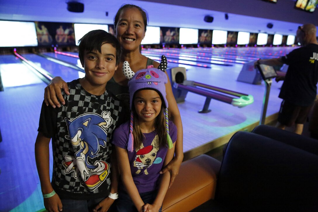 Marines, sailors and families bowl during the grand opening of Leatherneck Lanes, the remodeled base bowling alley on July 17 in the Mainside area of Camp Pendleton. The new bowling alley features a new scoring system, party rooms, lounge, arcade and pool tables. 

For more information visit: http://www.mccscp.com/bowl/

(Photo by Cpl. Orrin Farmer)