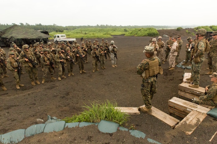 Capt. Roderick J. Singleton Jr., Combat Logistic Company 36 commanding officer, speaks to CLC-36 Marines and augments on his expectation for the squad movements and live fire range during Exercise Dragon Fire 2014 at Combined Arms Training Center Camp Fuji, Japan, July 17. Dragon Fire is CLC-36’s annual Battle Skills Training exercise that focuses on improving the individual and collective combat skills of CLC-36 service members with an emphasis on weapons familiarization training.