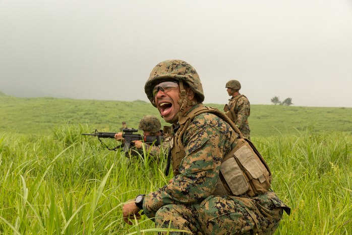 Capt. Roderick J. Singleton Jr., Combat Logistic Company 36 commanding officer, communicates with sergeants and staff noncommissioned officers during squad movements and live fire training as a part of Exercise Dragon Fire 2014 at Combined Arms Training Center Camp Fuji, Japan, July 17. To motivate the junior service members, sergeants and senior leaders with CLC-36 did the last squad rush to show efficient squad movements. Dragon Fire is CLC-36’s annual Battle Skills Training exercise that focuses on improving the individual and collective combat skills of CLC-36 Marines and sailors with an emphasis on weapons familiarization training.  