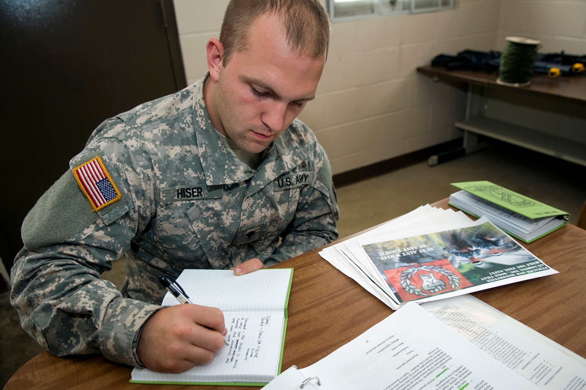 U.S. Army Spc. Daniel Hiser, 316th Psychological Operations Company PSYOP specialist, analyzes propaganda during a training scenario at Camp Atterbury Joint Maneuver Training Center, Ind., June 19, 2014. More than 30 PSYOP Soldiers from Grissom Air Reserve Base, Ind., took part in an intensive military support operations training at Camp Atterbury. (U.S. Air Force photo/Tech. Sgt. Mark R. W. Orders-Woempner)
