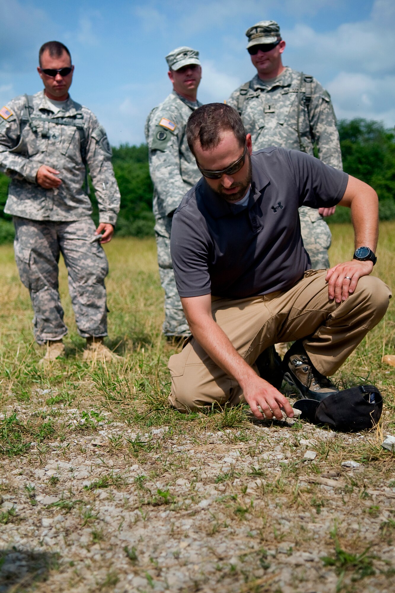 Michael Demo, a training integrator with the Counter IED Integration Cell at Camp Atterbury Joint Maneuver Training Center, Ind., explains tactical movements to 316th Psychological Operations Company PSYOP specialists from Grissom Air Reserve Base, Ind., at Camp Atterbury , June 19, 2014. More than 30 Grissom PSYOP Soldiers took part in an intensive military support operations training at Camp Atterbury. (U.S. Air Force photo/Tech. Sgt. Mark R. W. Orders-Woempner)
