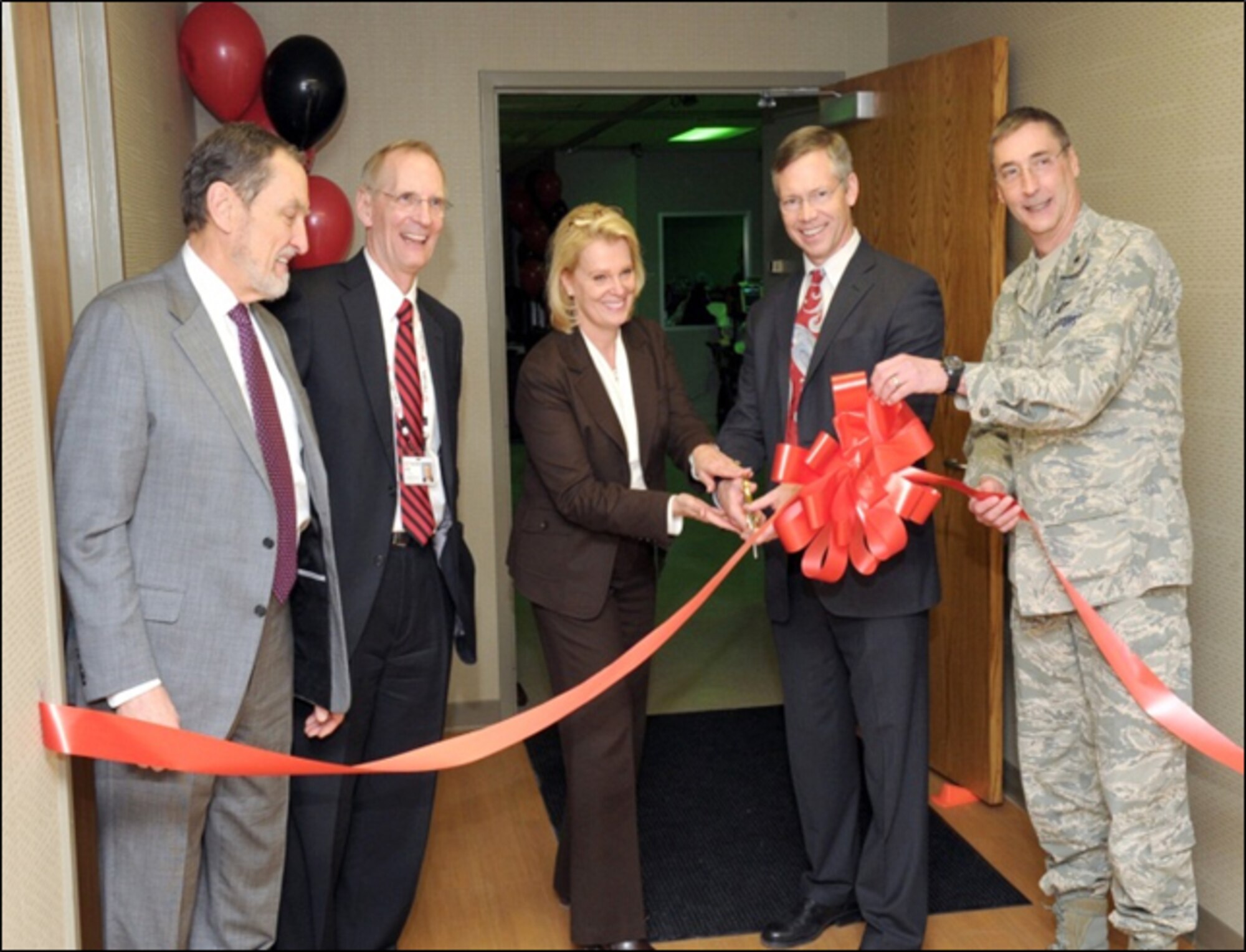 From left to right: UC College of Medicine Dean Dr. Thomas Boat; UC Health President and CEO Dr. Richard Lofgren; UC Medical Center President and CEO Ms. Lee Ann Liska; Department of Emergency Medicine Chair Dr. Arthur Pancioli; and Commander, 711th Human Performance Wing Brig Gen Timothy Jex at the ribbon cutting of the C-STARS Simulator Grand Opening. (Mr. Marvin Shelton/AFRL)