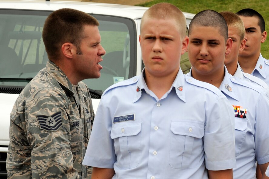 Tech. Sgt. Nicholous Banks, 2nd Security Forces Squadron and former Military Training Instructor, verbally corrects a Civil Air Patrol cadet during drill training at Barksdale Air Force Base, La., July 20, 2014. CAP cadets attend a week-long encampment, which is designed to give them a taste of basic training, teach physical fitness and team building skills. (U.S. Air Force photo/Tech. Sgt. Marie Brown)