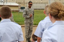 Master Sgt. George Corbett, 2nd Aircraft Maintenance Squadron and former Military Training Instructor, teaches Civil Air Patrol cadets how to properly render a salute during drill training at Barksdale Air Force Base, La., July 20, 2014. Each cadet also learned proper facing movements and how to work as a team when executing the movements. (U.S. Air Force photo/Tech. Sgt. Marie Brown)