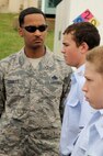 Master Sgt. George Corbett, 2nd Aircraft Maintenance Squadron and former Military Training Instructor, inspects the Civil Air Patrol cadets for proper flight alignment during drill training at Barksdale Air Force Base, La., July 20, 2014. Around 72 cadets went through a week-long encampment where they got a taste of basic training, learned team building skills and more. (U.S. Air Force photo/Tech. Sgt. Marie Brown)
