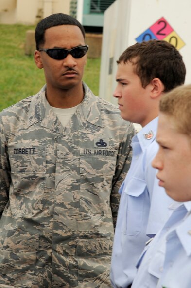 Master Sgt. George Corbett, 2nd Aircraft Maintenance Squadron and former Military Training Instructor, inspects the Civil Air Patrol cadets for proper flight alignment during drill training at Barksdale Air Force Base, La., July 20, 2014. Around 72 cadets went through a week-long encampment where they got a taste of basic training, learned team building skills and more. (U.S. Air Force photo/Tech. Sgt. Marie Brown)
