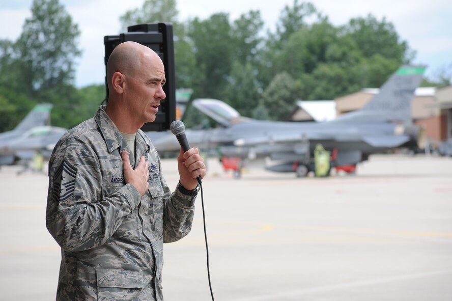 Chief Master Sgt. Ron Anderson, Command Chief of the Continental U.S. North American Aerospace Defense Command Region - 1st Air Force (Air Forces Northern), addresses the men and women of the 180th Fighter Wing during his visit July 16. While visiting the Ohio-based Air National Guard unit July 15-16, 2014, Anderson met with enlisted members of the wing and learned about the wing’s top performing Aerospace Control Alert mission and support units. The 180th Fighter Wing is one of 10 ANG units aligned under NORAD and 1st Air Force in support of Operation Noble Eagle and our nation’s homeland defense. (Air National Guard Photo by Staff Sgt. Amber Williams/Released).