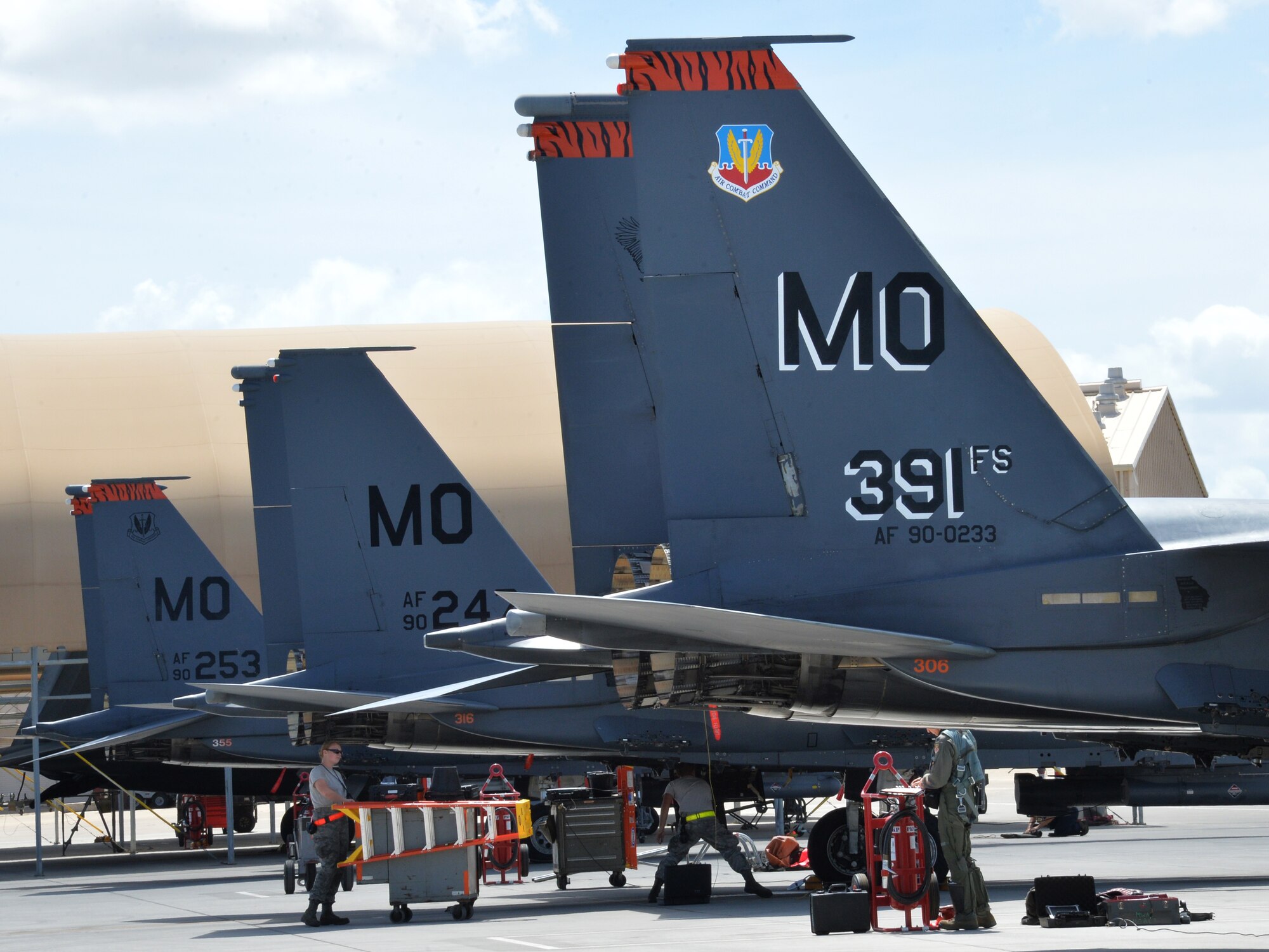 Flightline and aircraft crews prepare 391st Fighter Squadron F-15E Strike Eagles for a mission July 16, 2014, at Joint Base Pearl Harbor-Hickam, Hawaii. The 391st FS is currently on a two-month deployment here from Mountain Home Air Force Base, Idaho. While here, the squadron’s F-15Es have participated in Rim of the Pacific 2014 exercise missions. RIMPAC is a U.S. Pacific Command-hosted biennial multinational maritime exercise designed to foster and sustain international cooperation on the security of the world’s oceans. (U.S. Air Force photo by Staff Sgt. Alexander Martinez/Released)