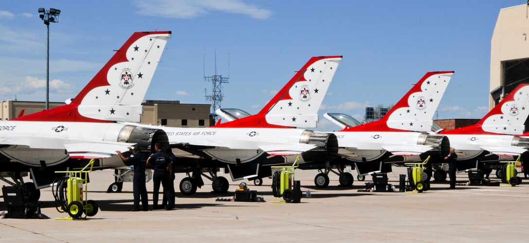 U.S. Air Force Thunderbirds F-16s, used in the air demonstrations, sit on the tarmac at the Wyoming Air National Guard base in Cheyenne, Wyo., July 21, 2014, while Thunderbirds maintainers ensure they are in their best shape. The Thunderbirds have visited and performed at an air show during Cheyenne Frontier Days every year in their 61-year history except for 2013 due to government sequestration. (U.S. Air Force photo by Airman 1st Class Jason Wiese)