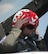 Wes Welker, Denver Broncos wide receiver, puts on a flight helm and mask July 20, 2014, before his flight with the U.S. Air Force Thunderbirds. Welker was one of two participants given the opportunity to ride in the passenger seat as a Thunderbirds pilot performed aerial maneuvers. (U.S. Air Force photo by Airman 1st Class Brandon Valle)