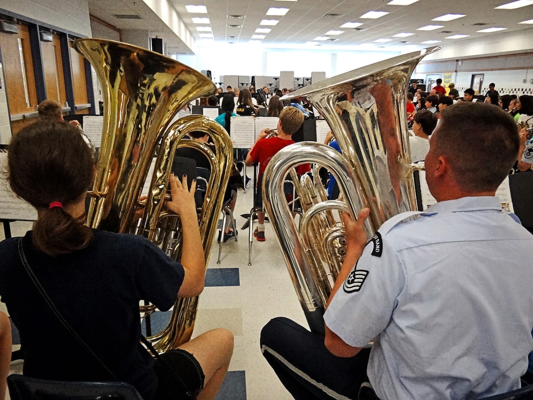 TSgt Daniel Walley rehearses with the Vienna Band Camp concert band along with other members of the Air Force Band.  Over 500 students were reached at this AIM event. (US Air Force photo by TSgt Ricky Parrell/released)