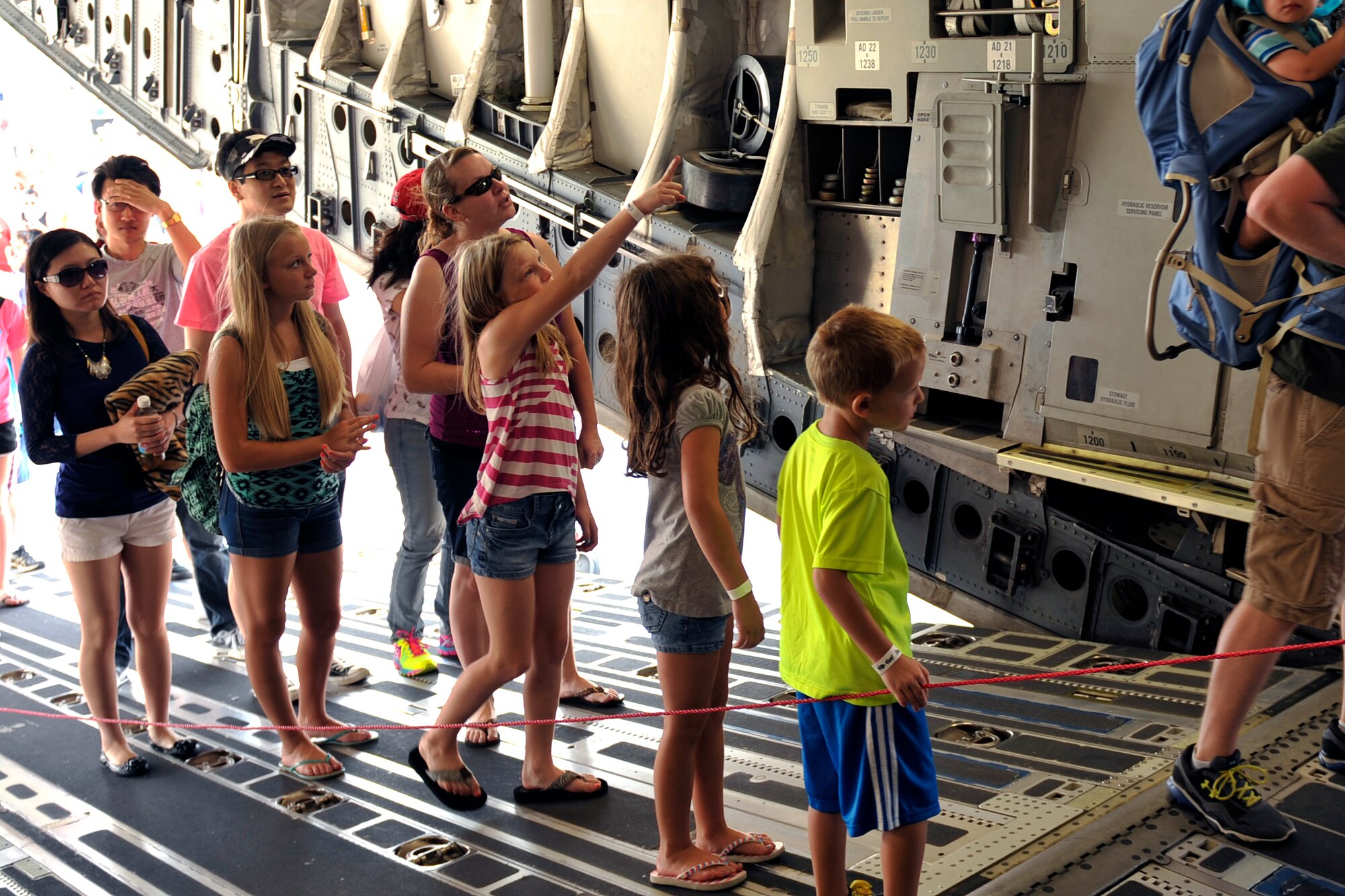 Children take a closer look at the inside of a C-17 Globemaster III at the 2014 Defenders of Freedom Open House and Air Show July 19 at Offutt Air Force Base, Nebraska.  Patrons toured the static displays as U.S. Air Force Airmen introduced them to the qualities of the aircraft and answered their questions.  (U.S. Air Force photo by Jeff W. Gates/Released)