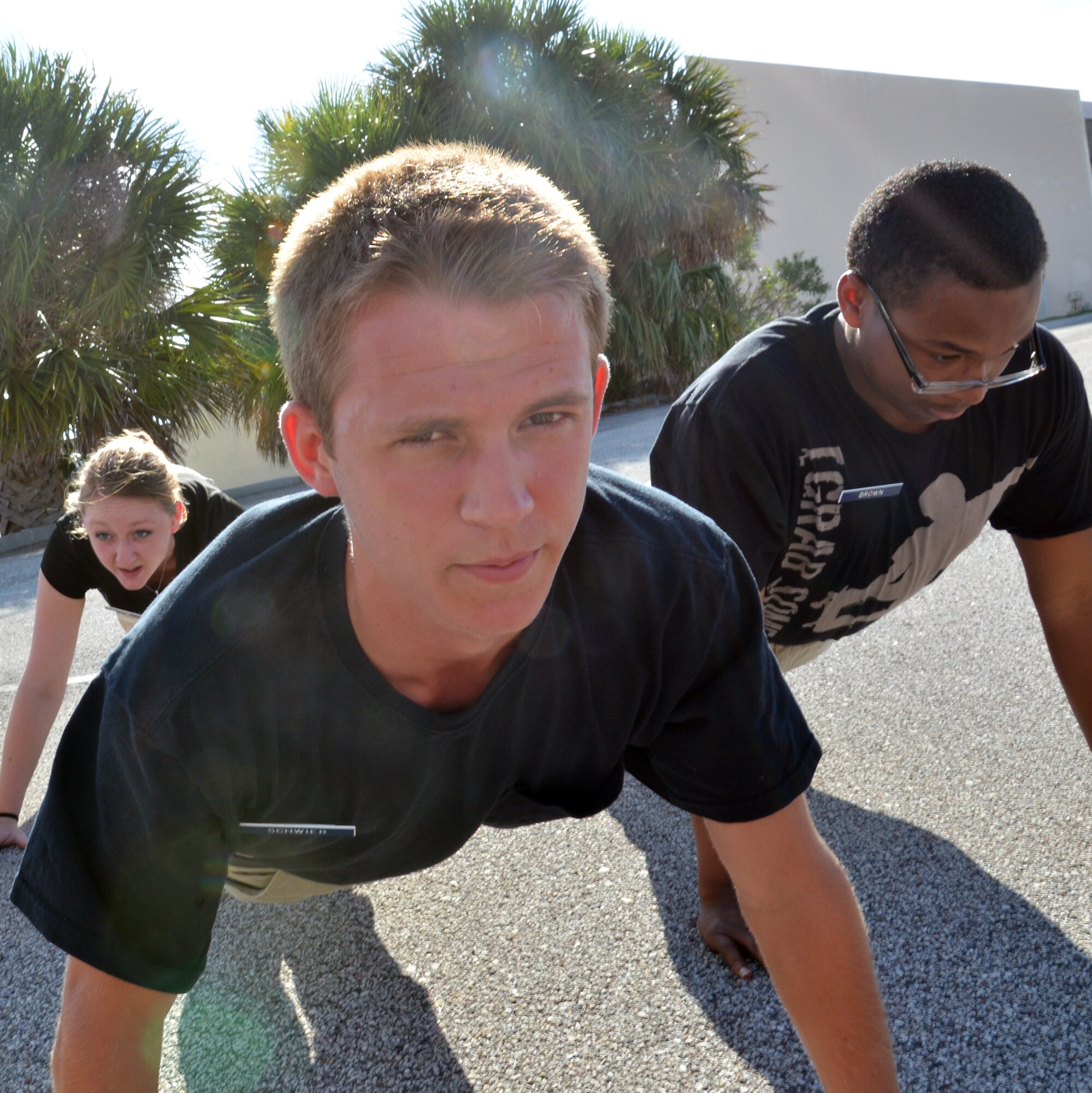 Austin R. Schwier, 18, trainee with the Developmental and Training Flight, gears up for the day with a few pushups during a unit training assembly at Patrick Air Force Base, Fla., July 12, 2014.
