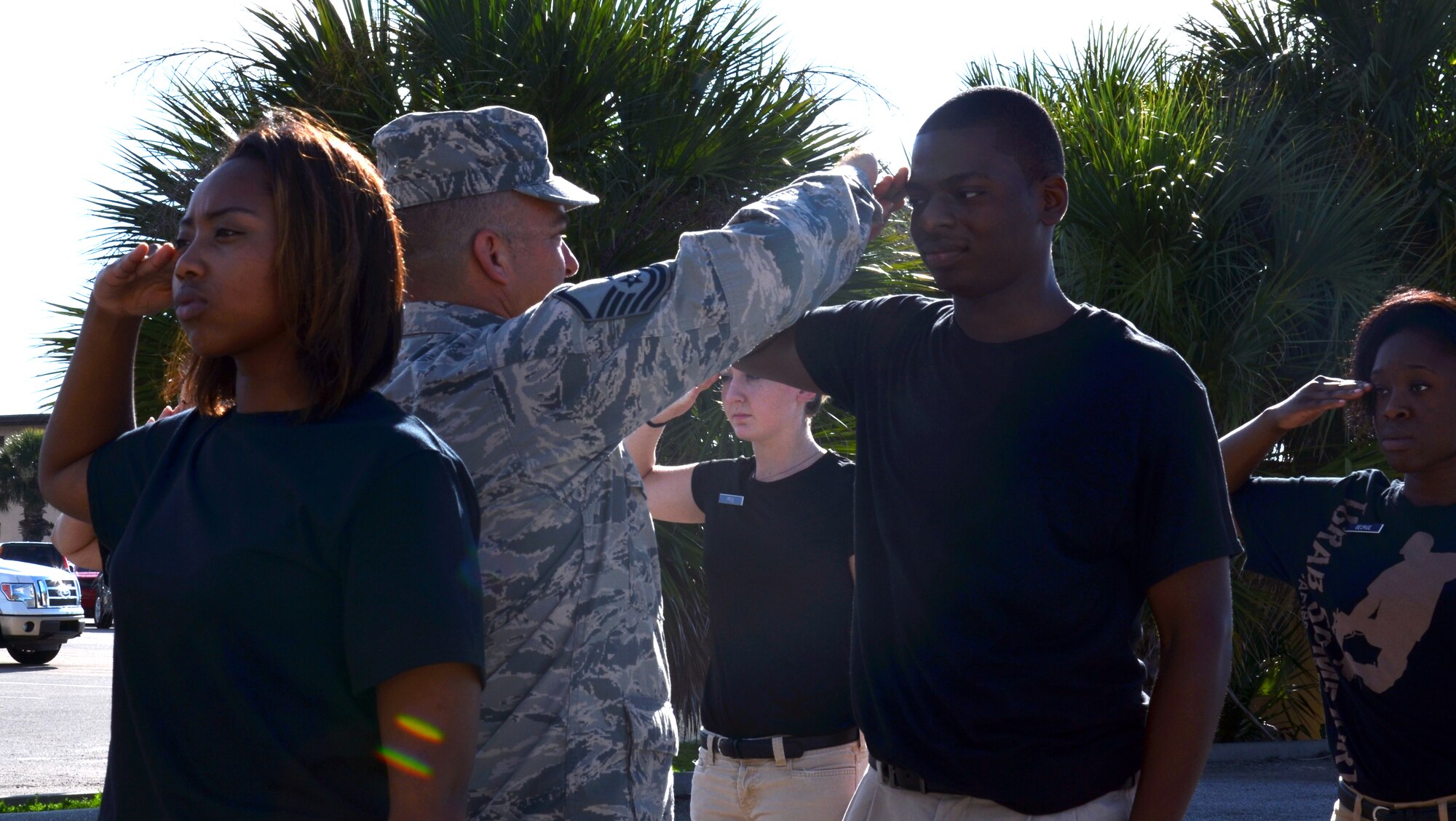 Master Sgt. Tommy C. Cowen, Developmental and Training Flight program manager assigned to the 920th Rescue Wing, provides assistants to trainee Manuel Oneal, 21, avionics systems specialist assigned to the 920th Maintenance Squadron, on how to salute during a unit’s training assembly at Patrick Air Force Base, Fla., July 12, 2014.