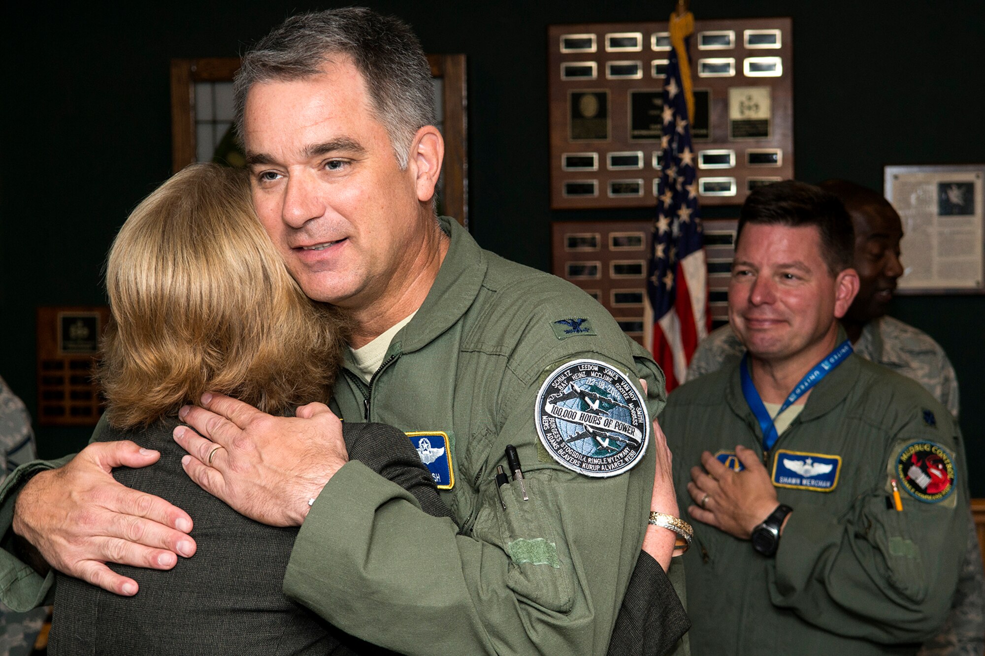U.S. Air Force Col. David Leedom hugs Julie Denmark during a farewell luncheon held in her honor on July 18, 2014, Barksdale Air Force Base, La. Denmark is the secretary for the 307th Bomb Wing commander and is leaving Barksdale for a job in the Washington, D.C. area. (U.S. Air Force photo by Master Sgt. Greg Steele/Released)