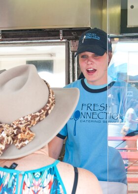 Airman 1st Class Kaylyn Jones, 90th Missile Security Forces Squadron, takes a customer’s order at a food stand in Frontier Park during Cheyenne Frontier Days July 19, 2014. Jones and is one of approximately 350 90th MSFS defenders signed up to work during CFD. (U.S. Air Force photo by Airman 1st Class Jason Wiese)
