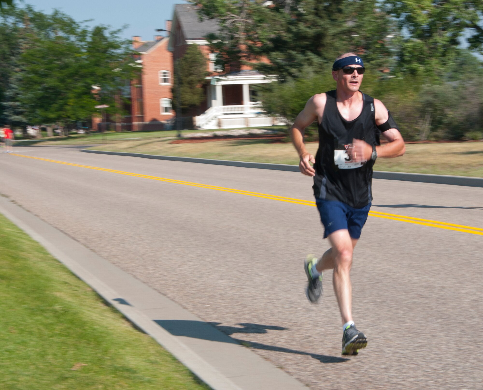 Steve Loose makes his way toward the finish line in the F.E. Warren Air Force Base’s 36th annual Buffalo Stampede 10K race July 19, 2014, near the Argonne Parade Field. Approximately 100 Airmen, loved ones and people from the civilian community ran the race. (U.S. Air Force photo by Airmen 1st Class Jason Wiese)